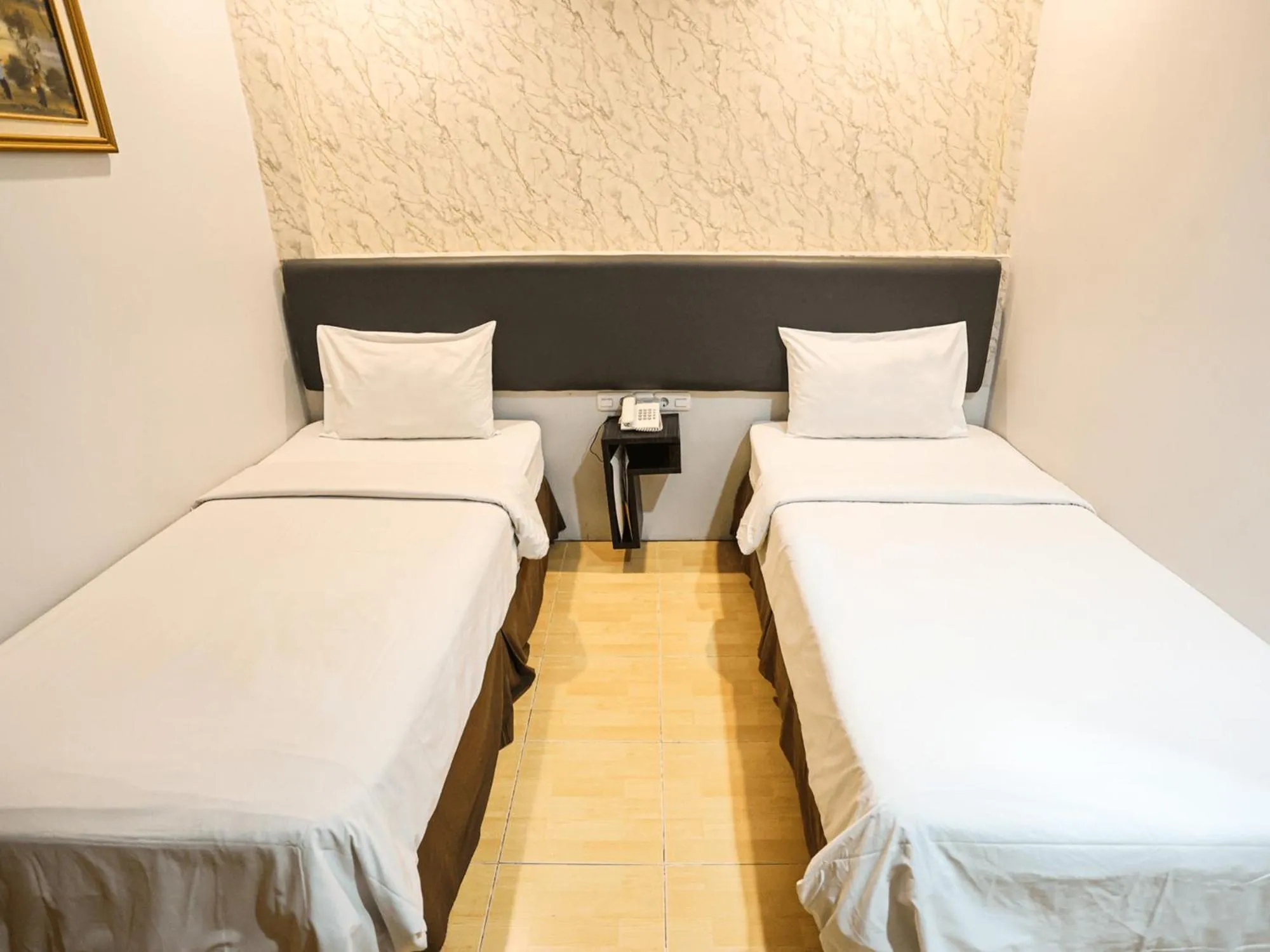 Bed in Grande Hotel Lampung Powered by Archipelago