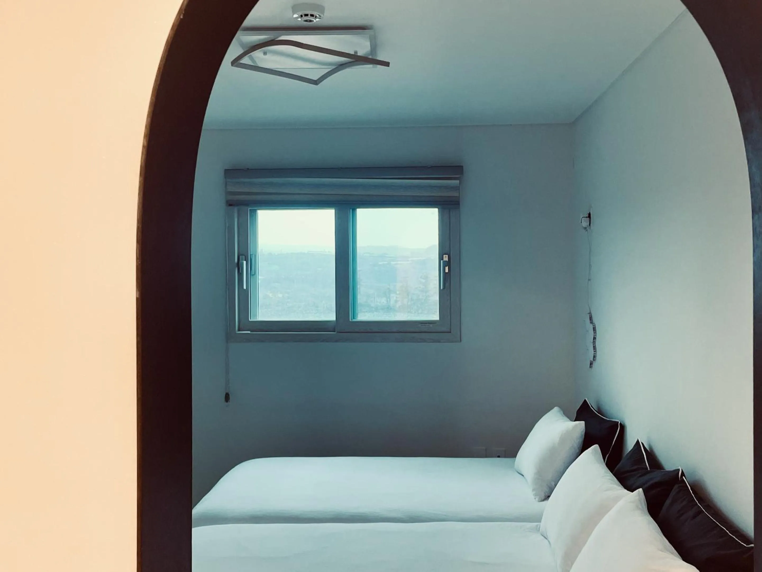 Bed in Jeju Private Poolvilla Gwakjidaon Stay