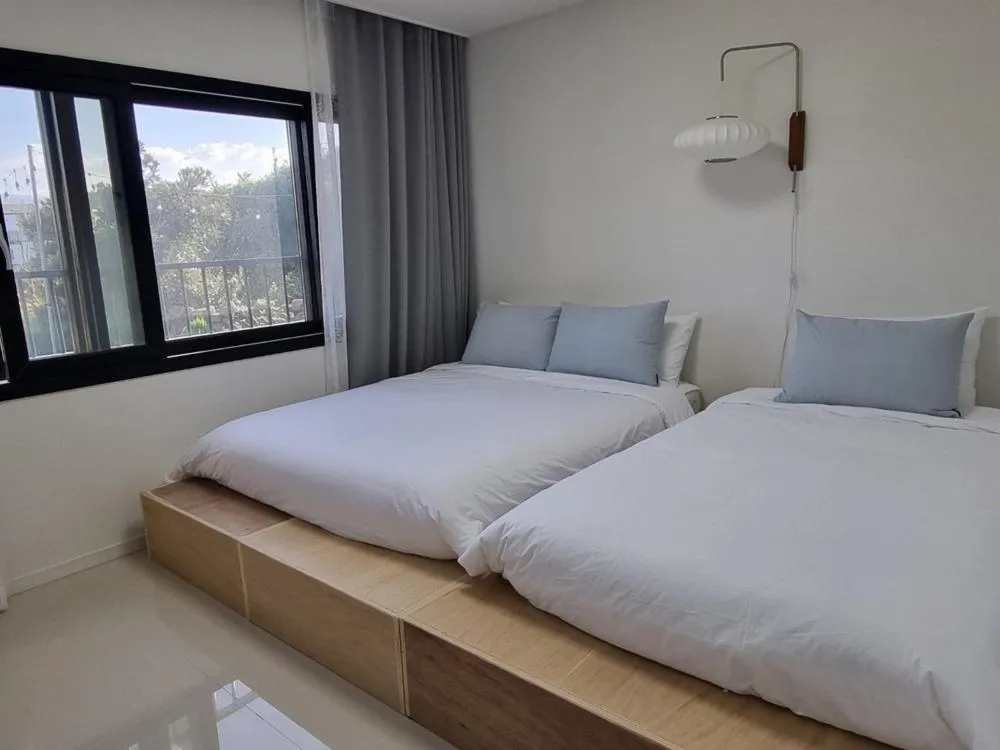 Bed in Jeju Ianstay