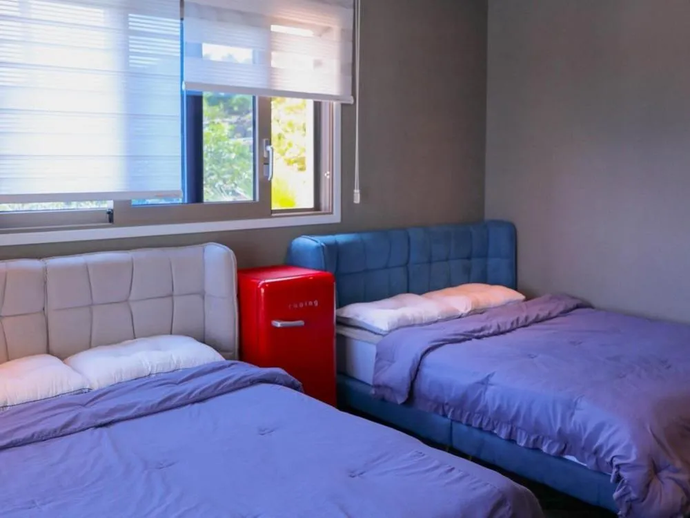 Bed in Jeju Sky Castle Pool Villa