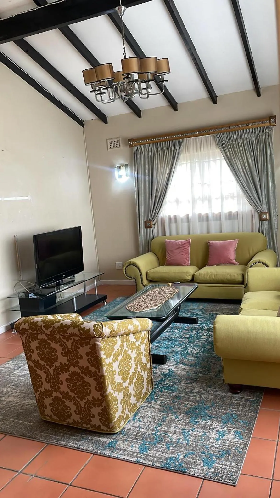 Communal lounge/ TV room in Carrington Guest House