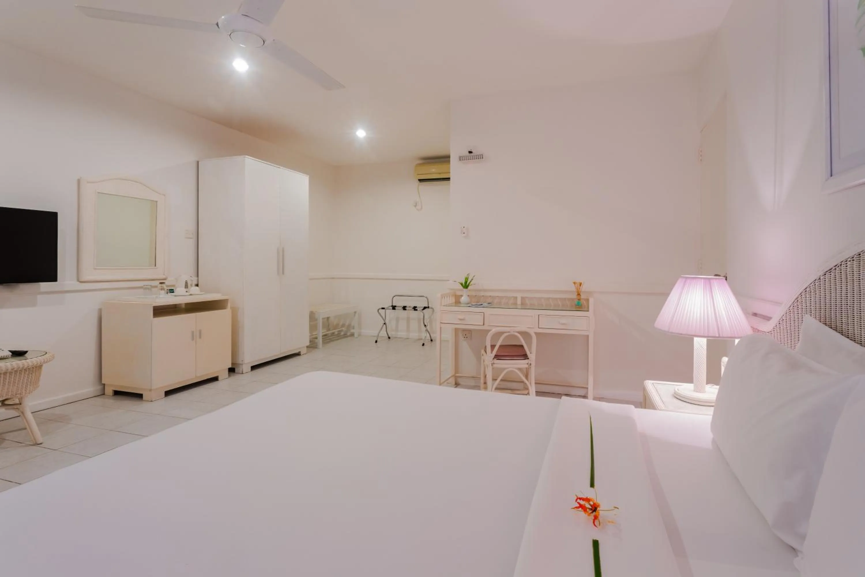 Bed in Equator Village Maldives