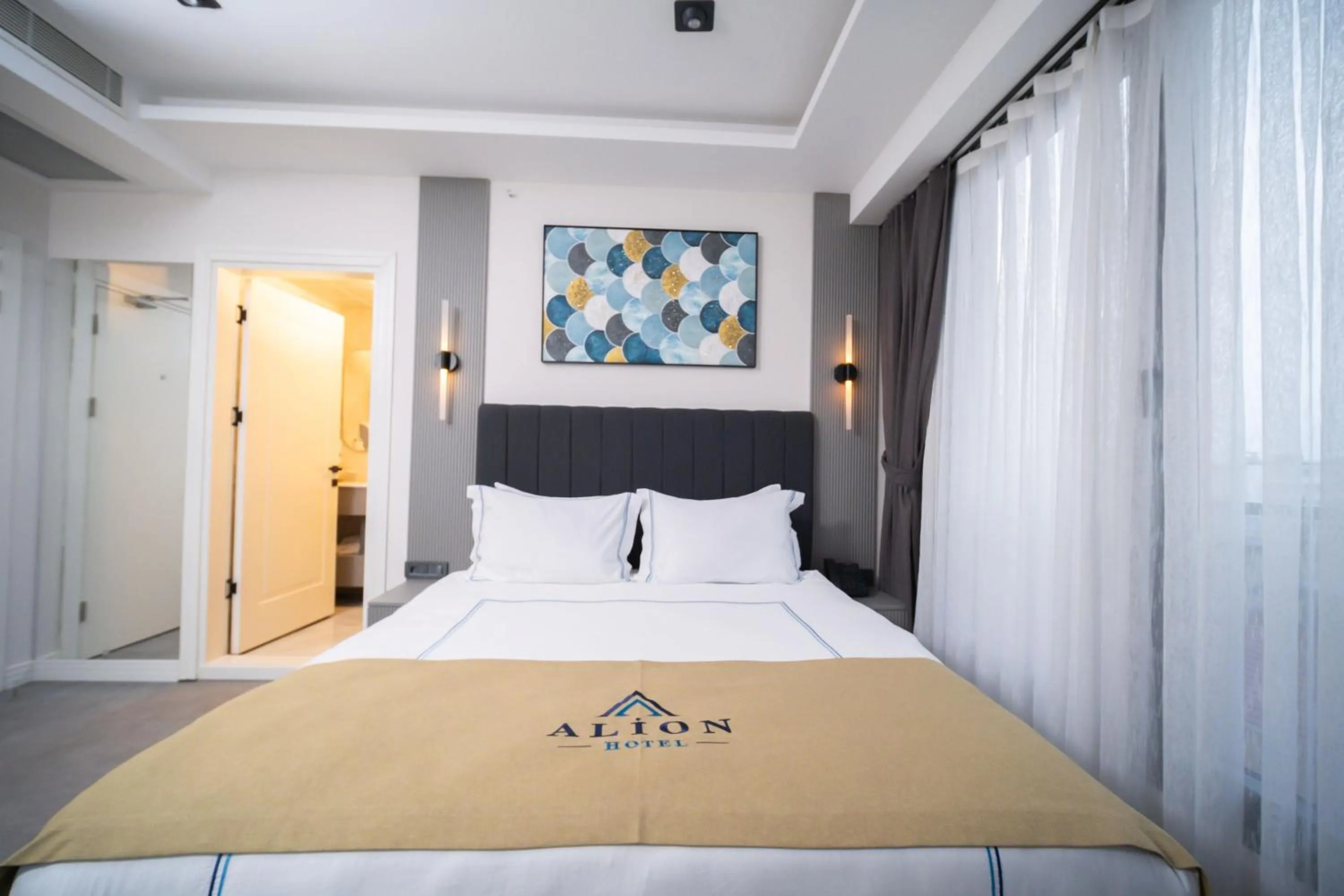 Bed in Alion Hotel
