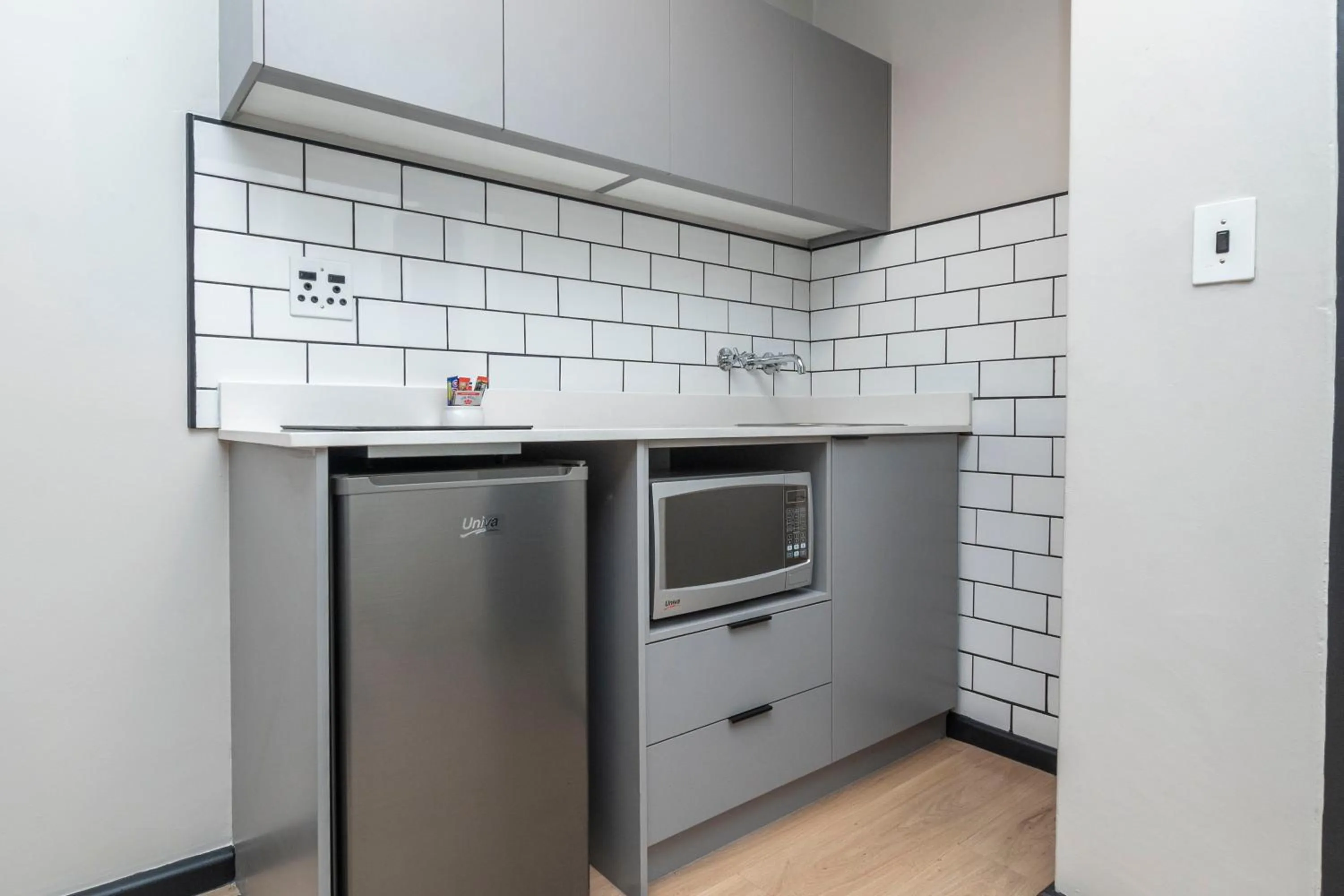 Kitchen or kitchenette in HAVN Aparthotel by Totalstay