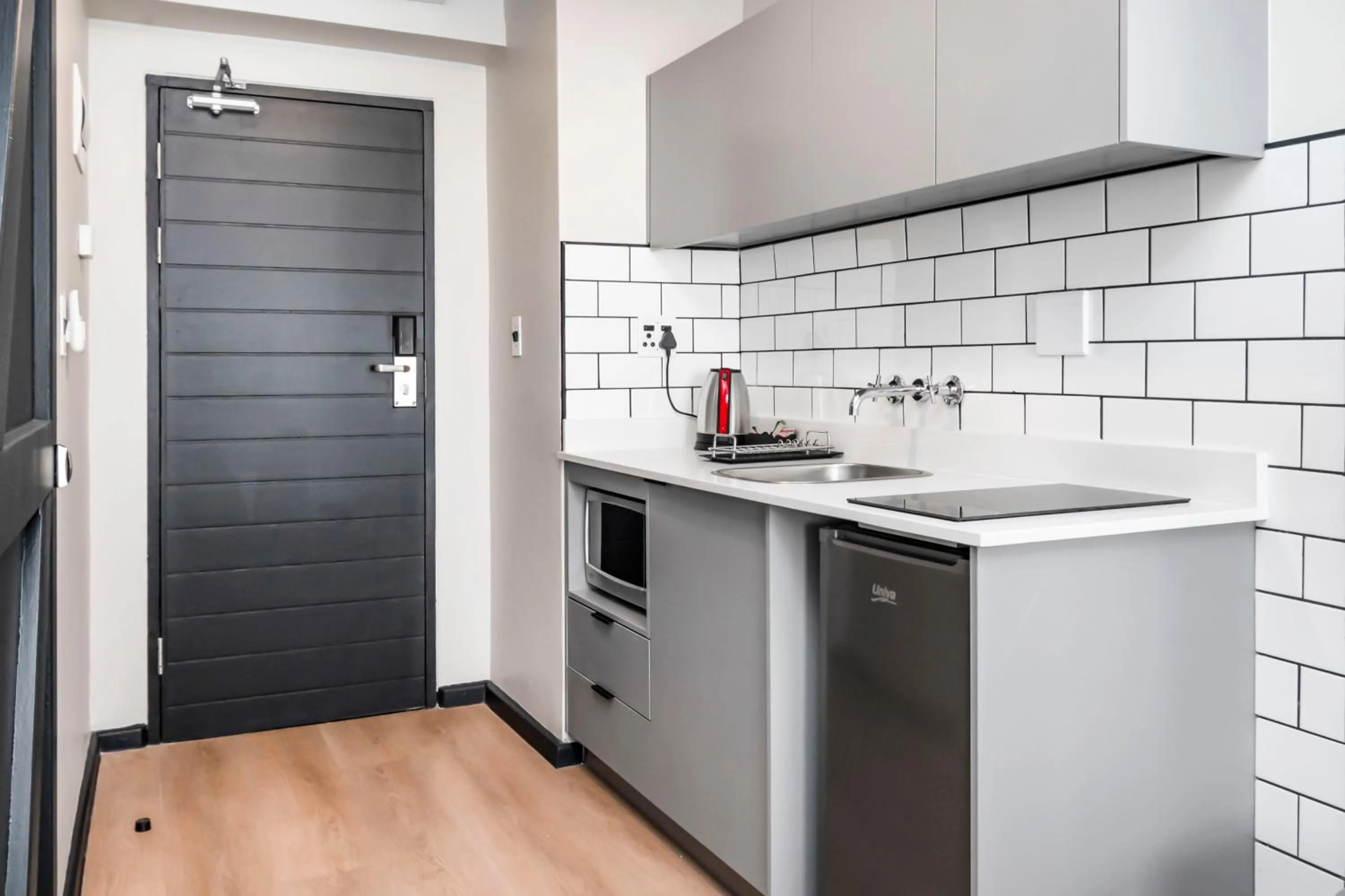 Kitchen or kitchenette in HAVN Aparthotel by Totalstay