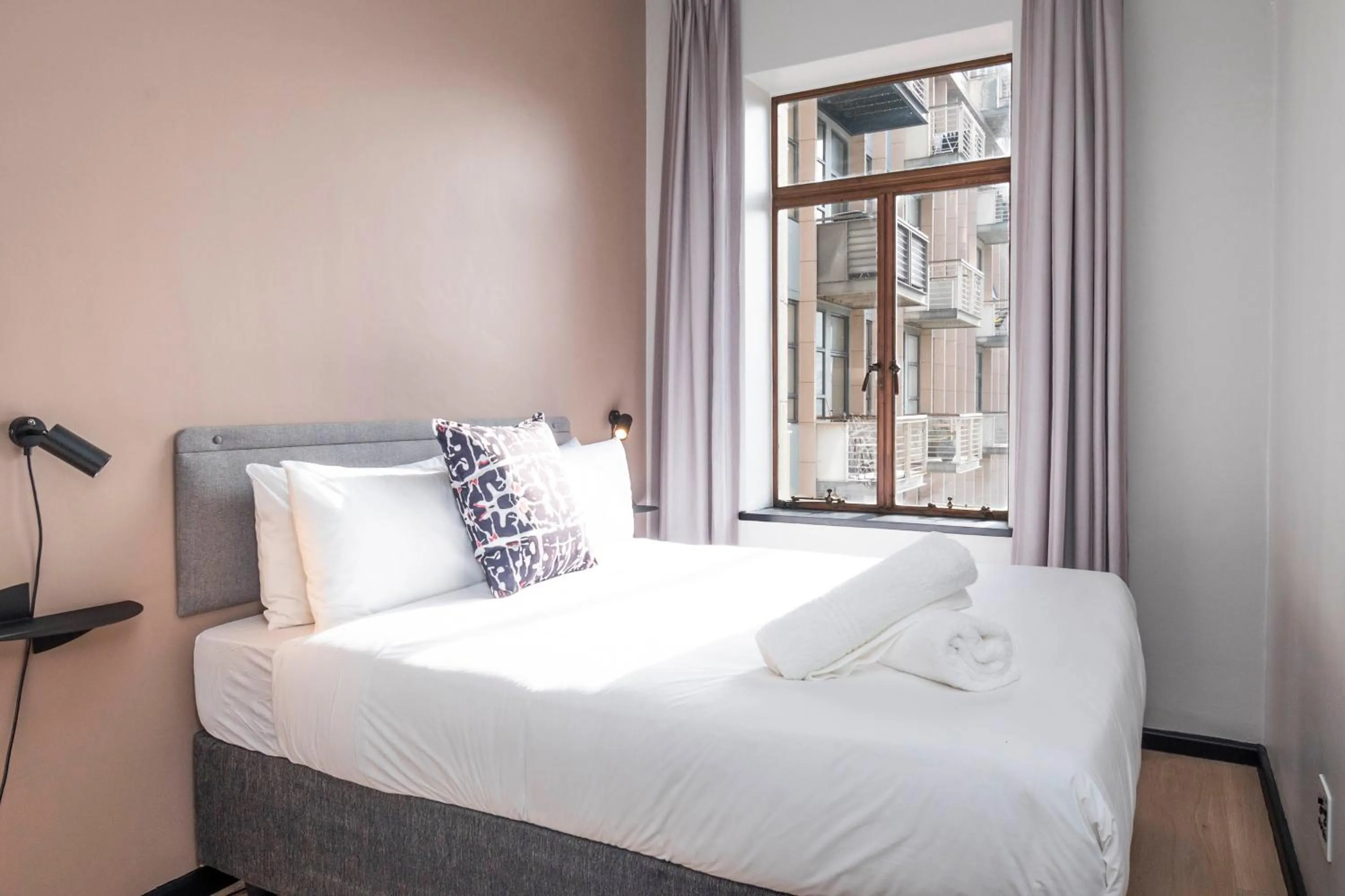 Bed in HAVN Aparthotel by Totalstay