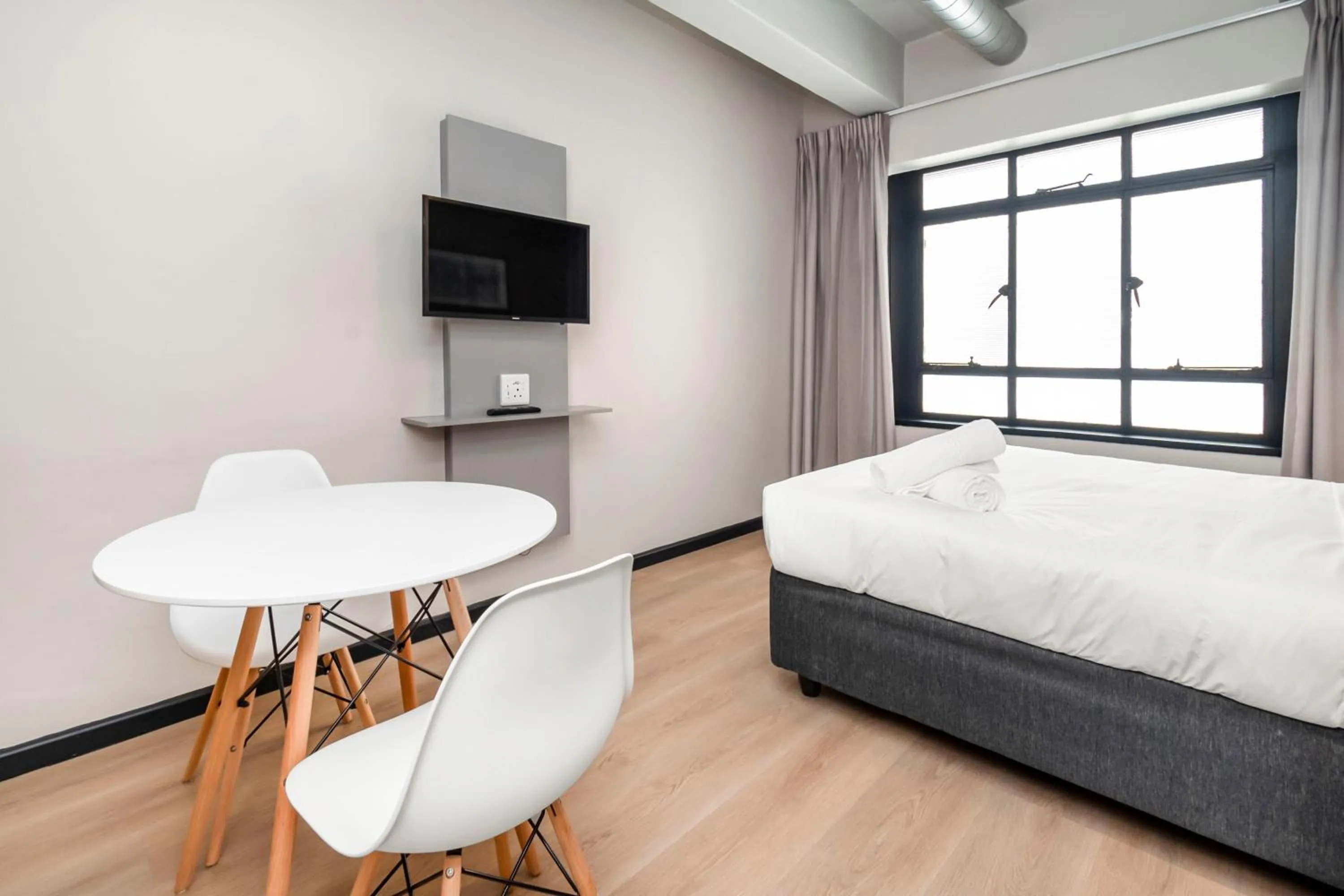 Bed in HAVN Aparthotel by Totalstay