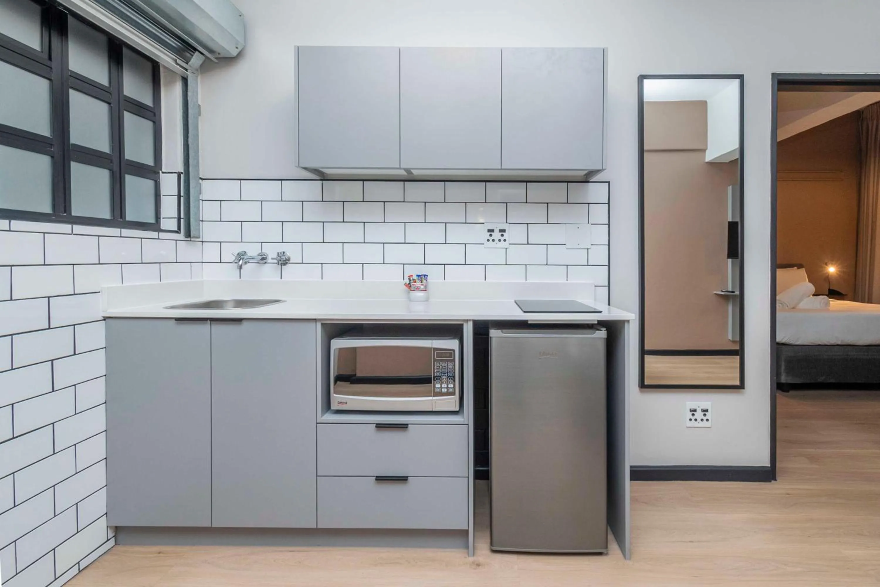 Kitchen or kitchenette in HAVN Aparthotel by Totalstay