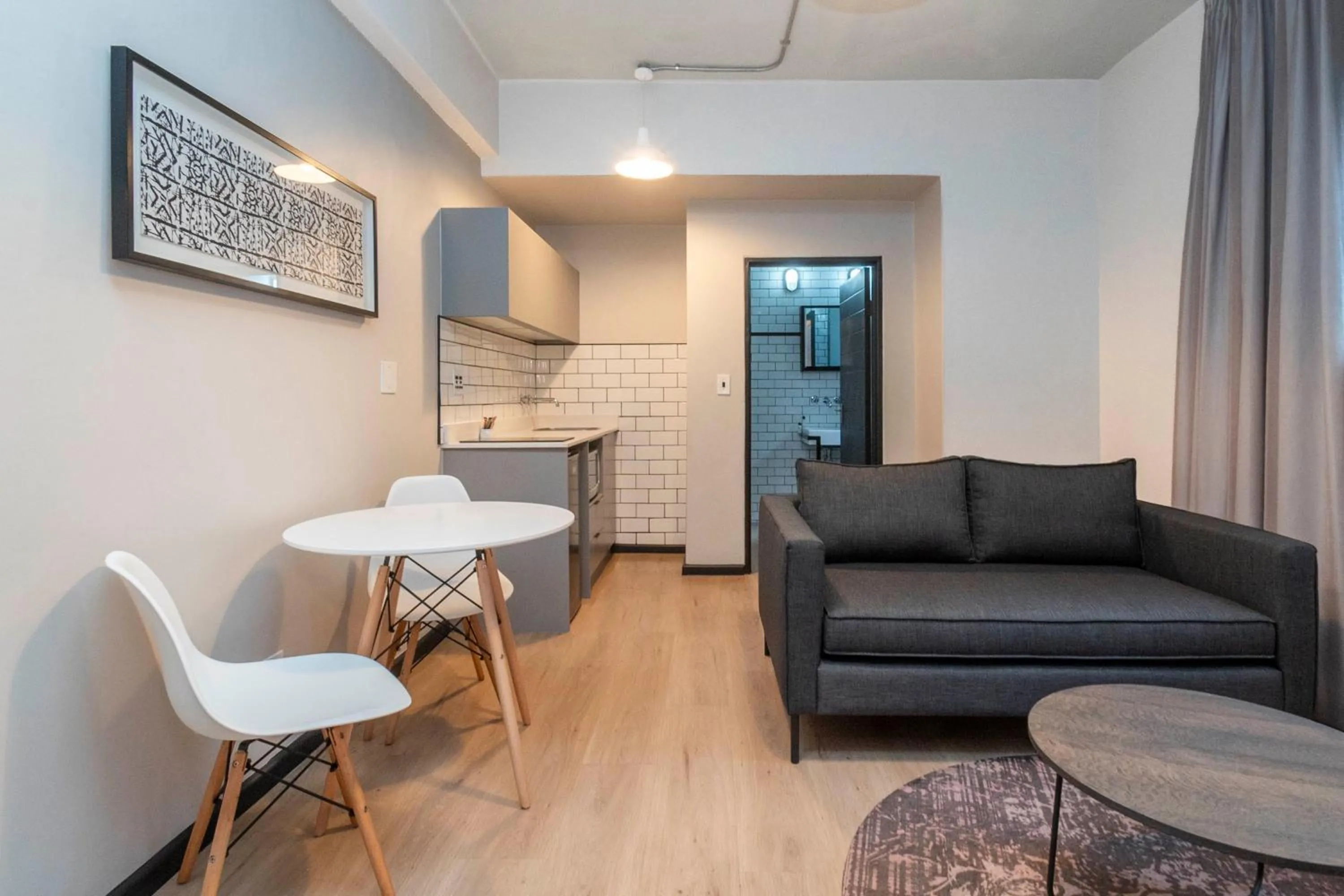 Seating area in HAVN Aparthotel by Totalstay