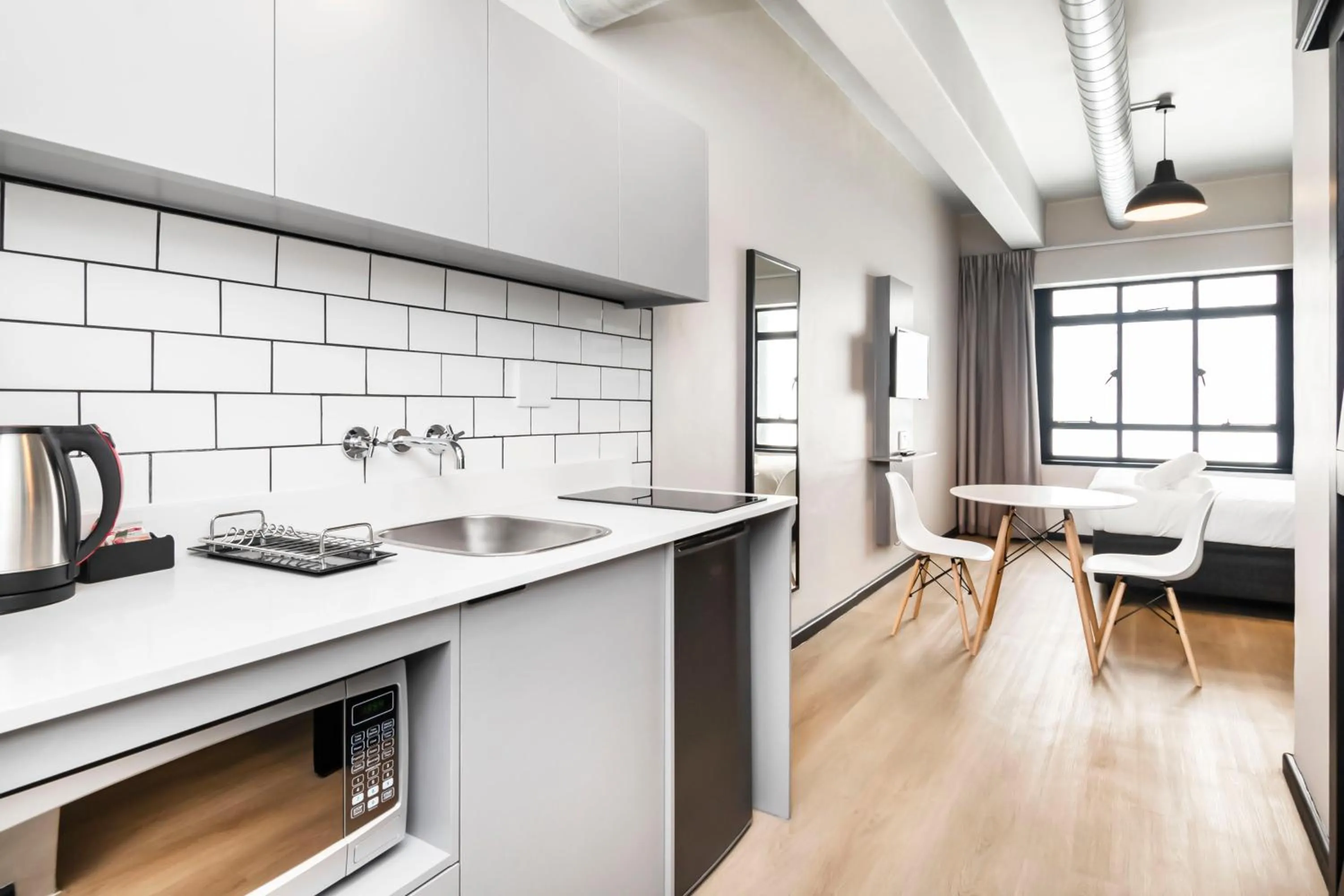 Kitchen or kitchenette in HAVN Aparthotel by Totalstay