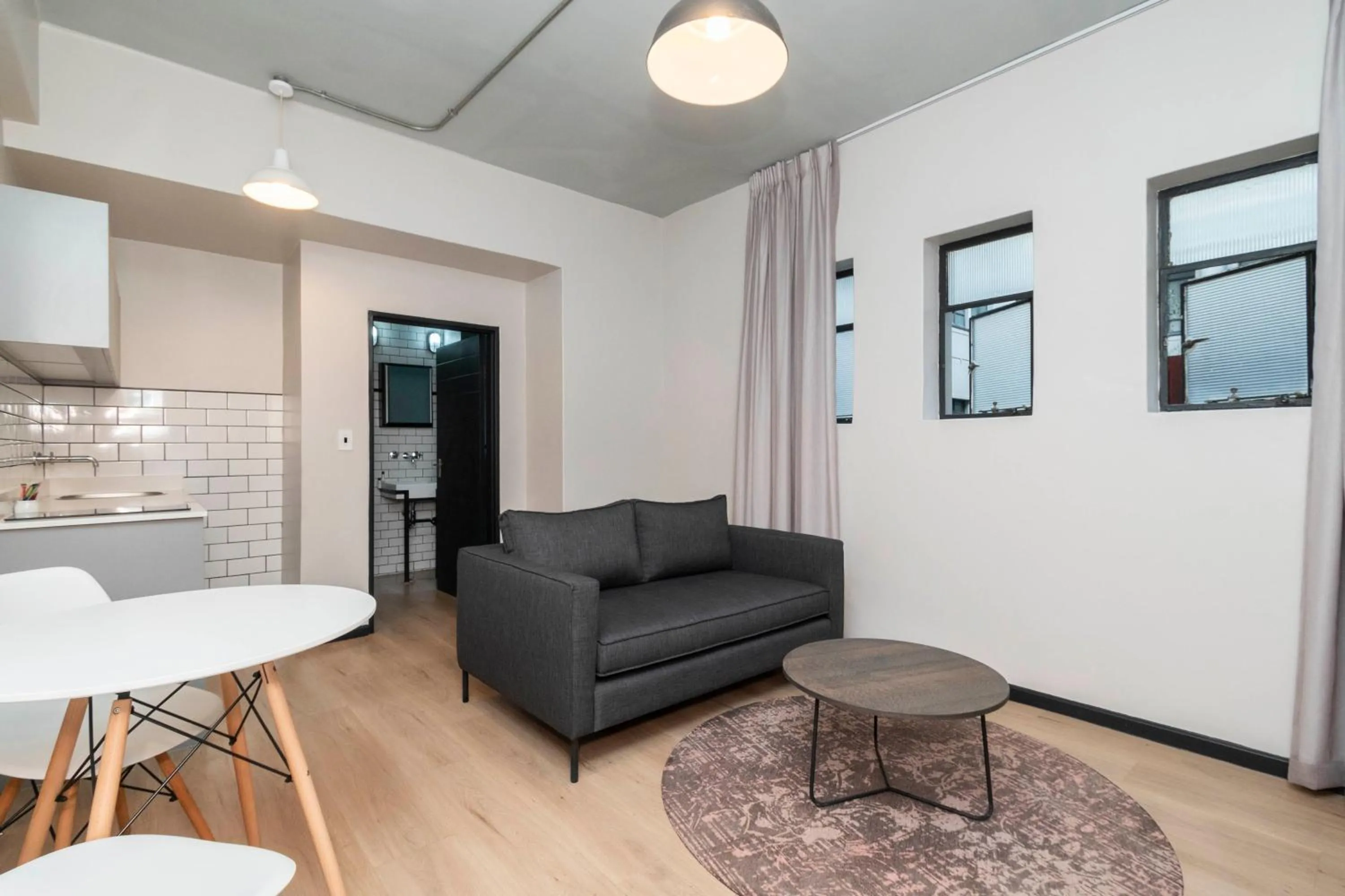 Seating area in HAVN Aparthotel by Totalstay