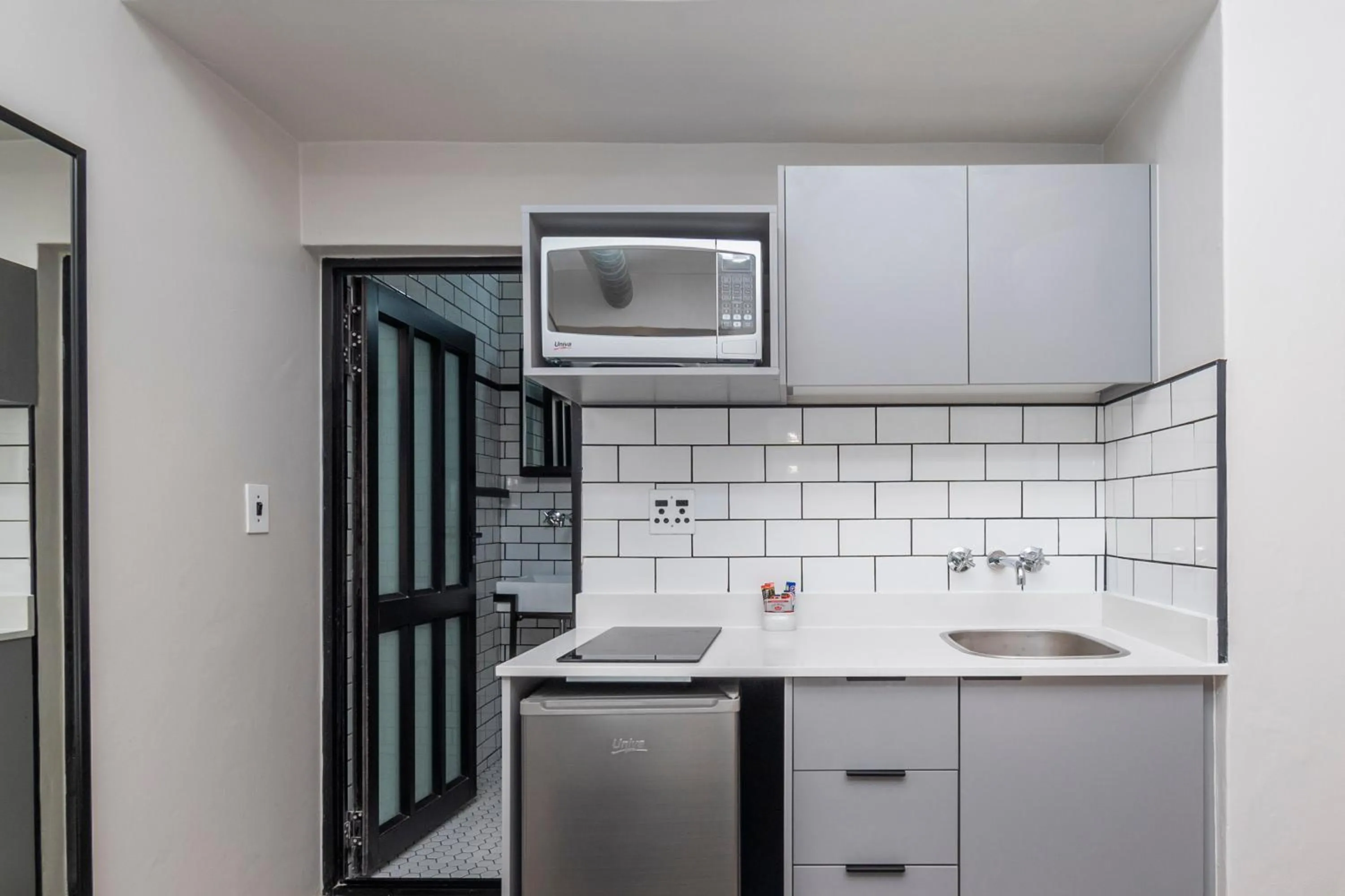 Kitchen or kitchenette in HAVN Aparthotel by Totalstay