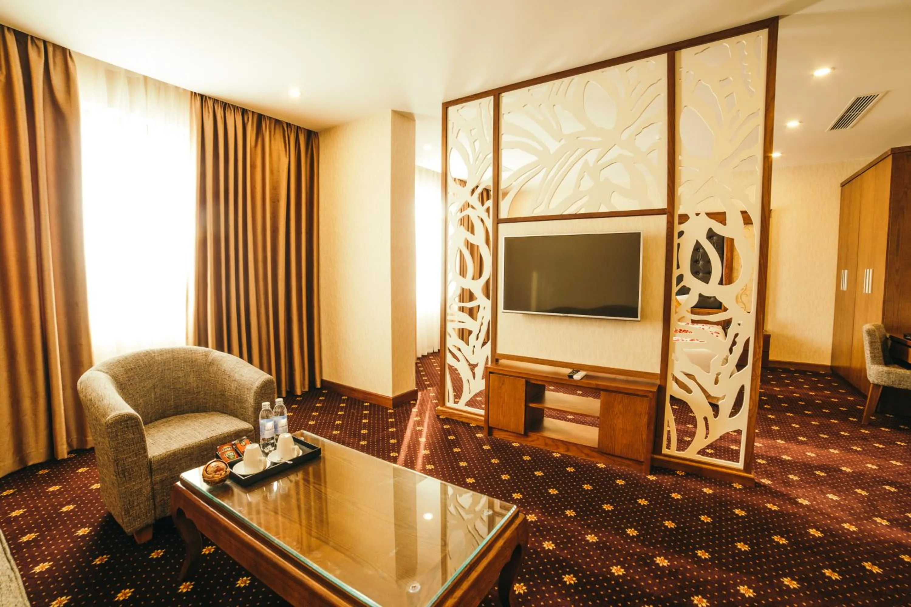 Communal lounge/ TV room in Grand Móng Cái Hotel