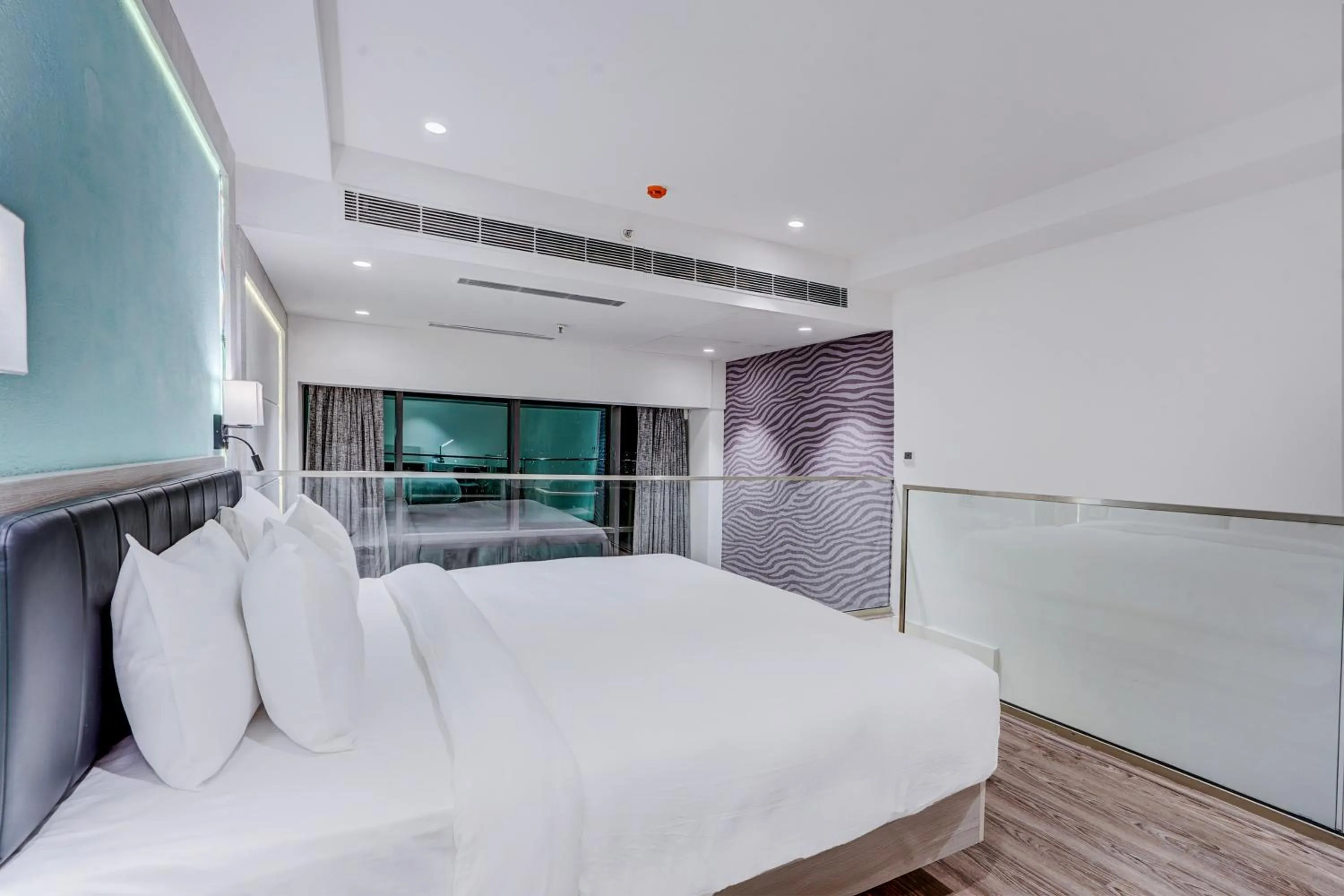 Photo of the whole room, Bed in Sunday Hotel & Residences by CheckIn Gurugram