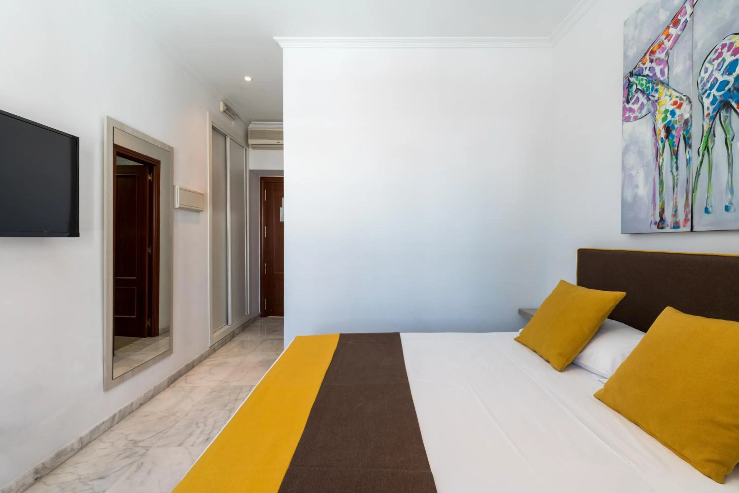 Bed in Cool Sevilla Hotel