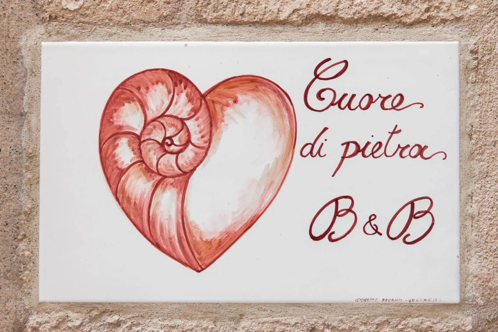 Property logo or sign in Cuore di Pietra - Housea
