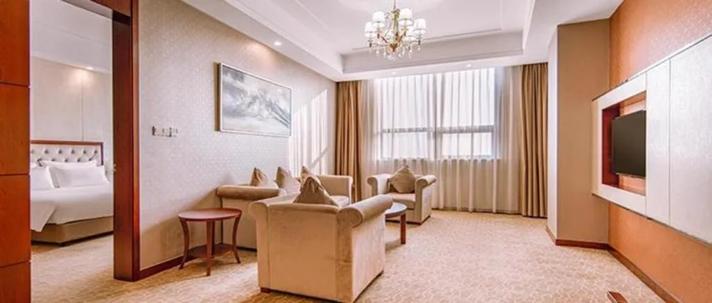 Bed in New Century Hotel Putuo Zhoushan