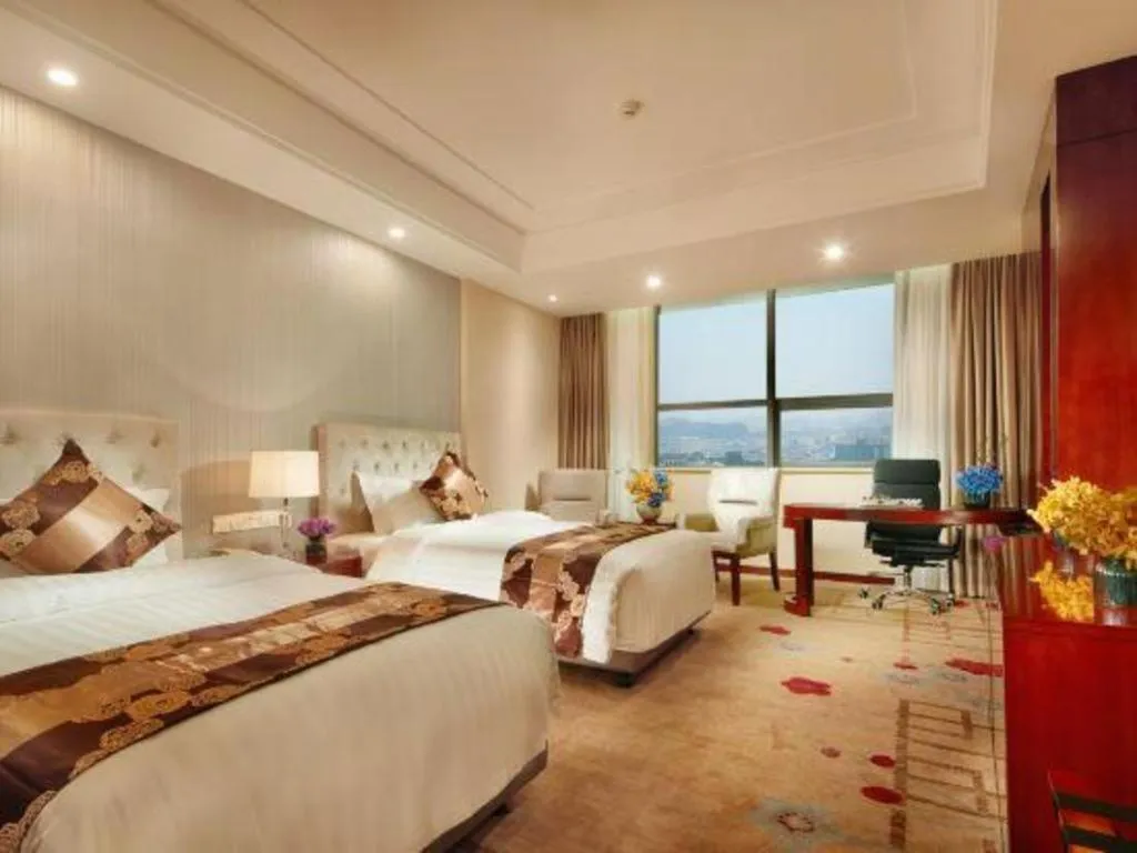 Bed in New Century Hotel Putuo Zhoushan