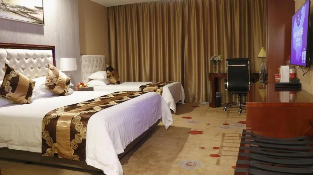 Bed in New Century Hotel Putuo Zhoushan