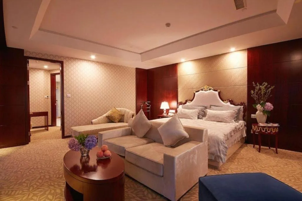 Bed in New Century Hotel Putuo Zhoushan