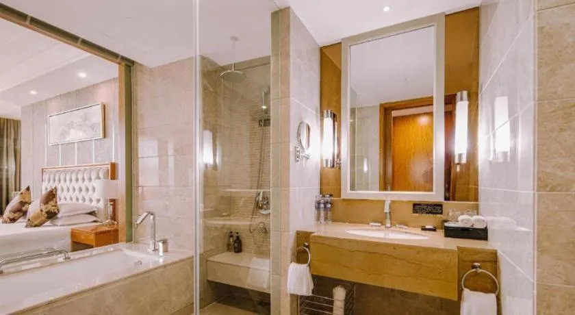 Bed in New Century Hotel Putuo Zhoushan