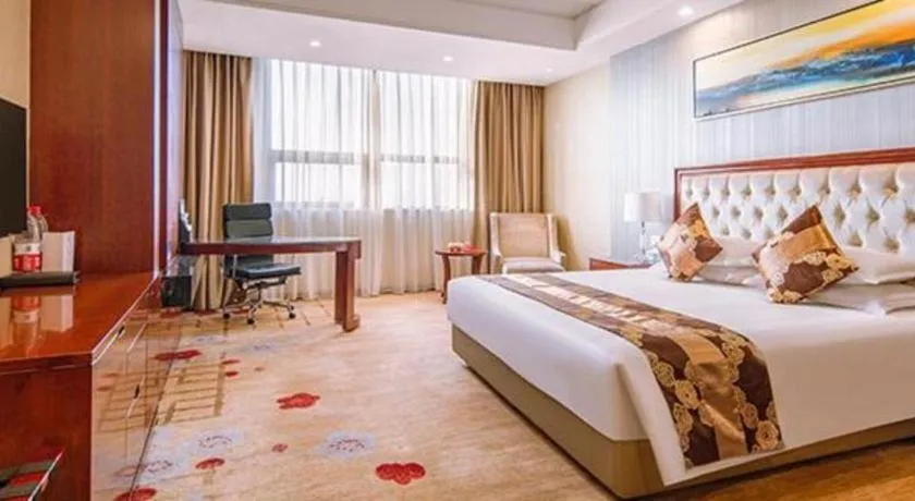 Bed in New Century Hotel Putuo Zhoushan