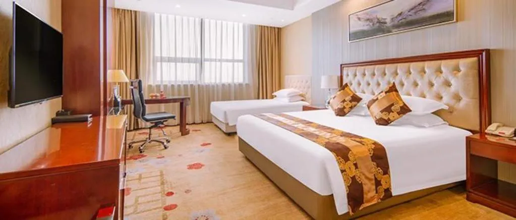 Bed in New Century Hotel Putuo Zhoushan