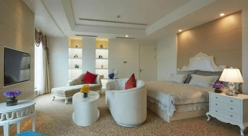 Bed in New Century Hotel Putuo Zhoushan