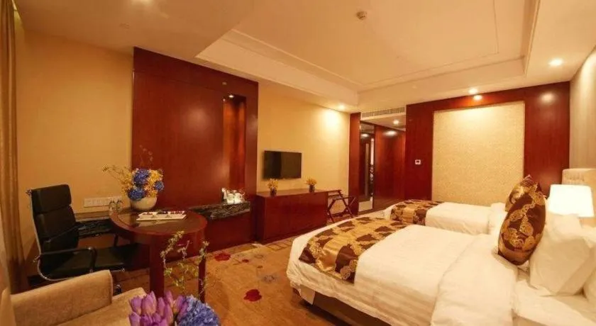 Bed in New Century Hotel Putuo Zhoushan