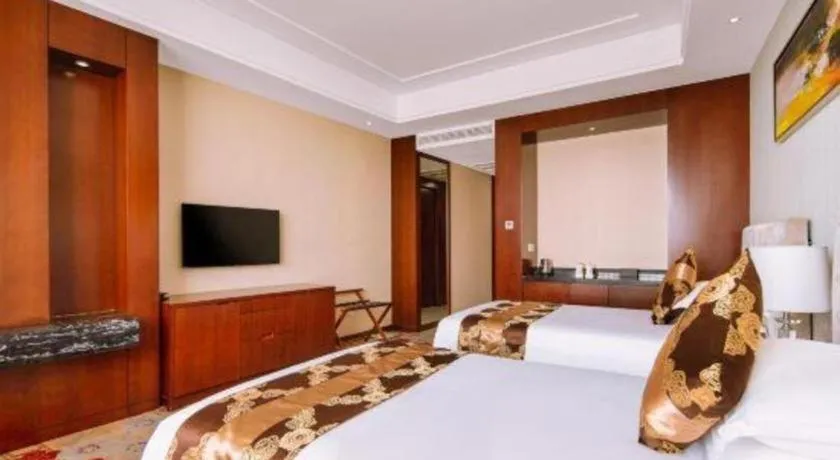 Bed in New Century Hotel Putuo Zhoushan