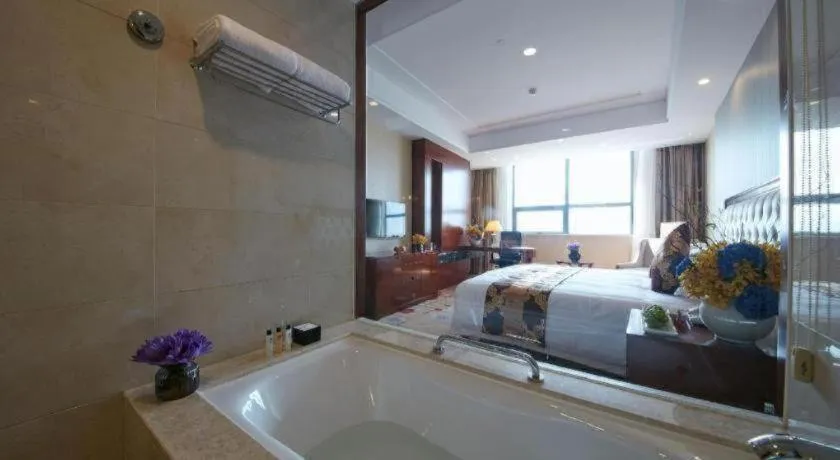 Bed in New Century Hotel Putuo Zhoushan