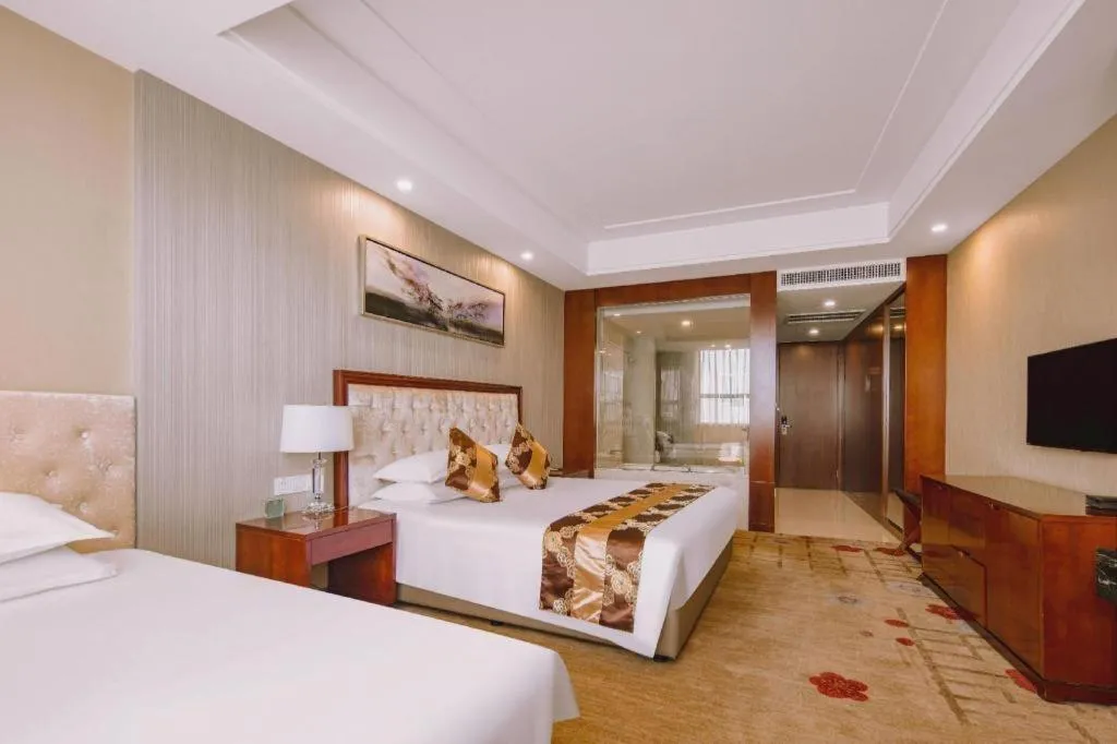 Bed in New Century Hotel Putuo Zhoushan