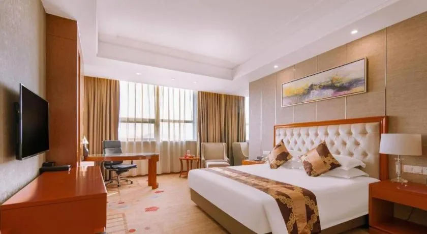 Bed in New Century Hotel Putuo Zhoushan