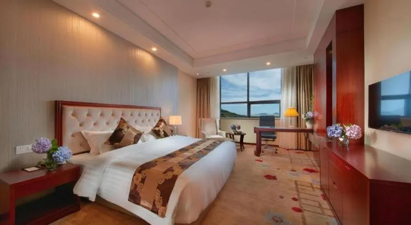 Bed in New Century Hotel Putuo Zhoushan