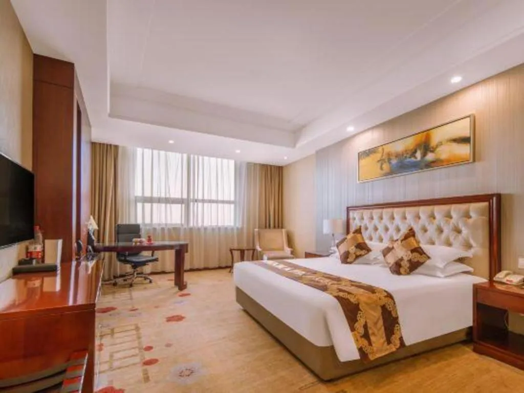 Bed in New Century Hotel Putuo Zhoushan