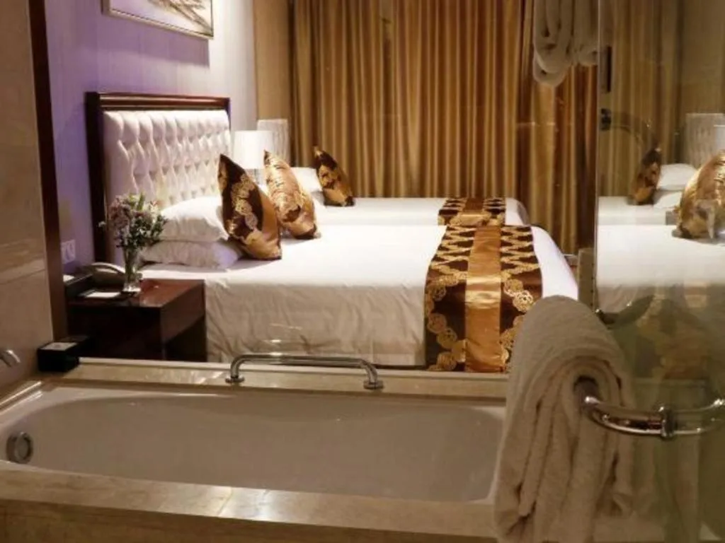 Bed in New Century Hotel Putuo Zhoushan