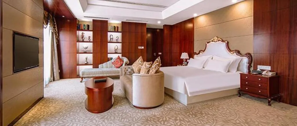 Bed in New Century Hotel Putuo Zhoushan