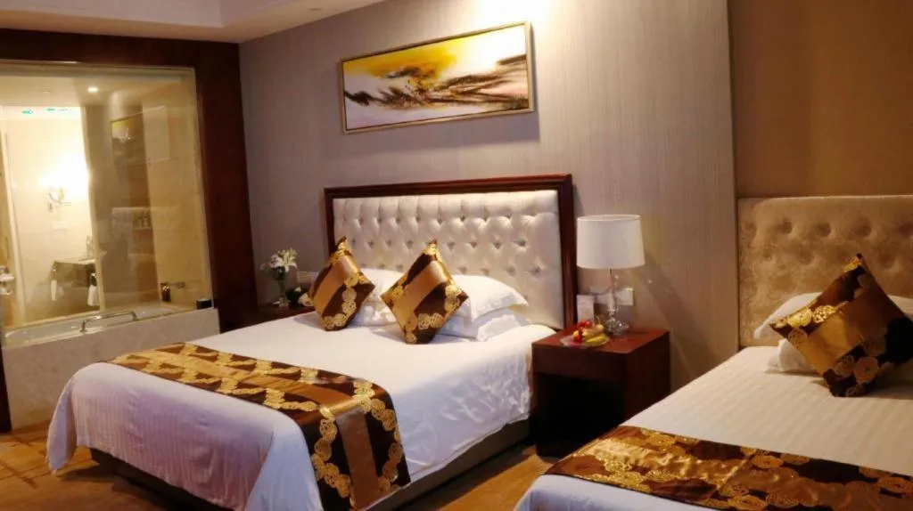 Bed in New Century Hotel Putuo Zhoushan