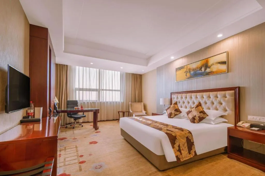 Bed in New Century Hotel Putuo Zhoushan