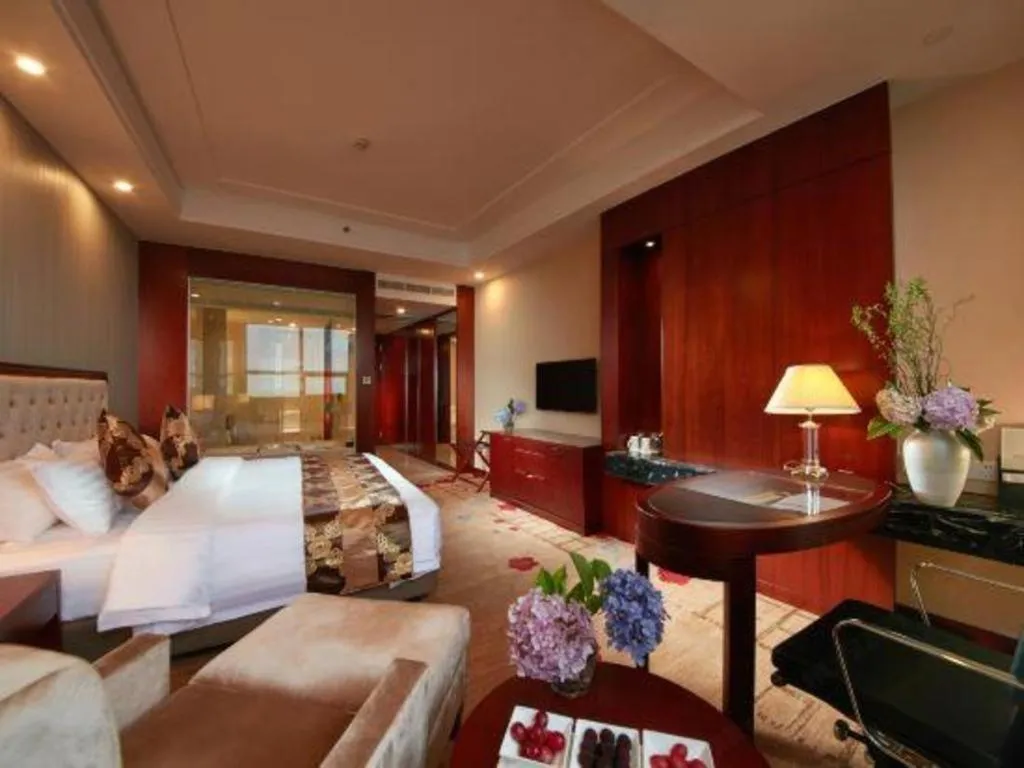 Bed in New Century Hotel Putuo Zhoushan