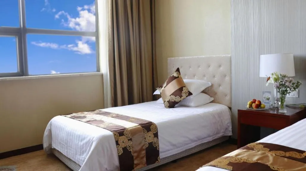 Bed in New Century Hotel Putuo Zhoushan