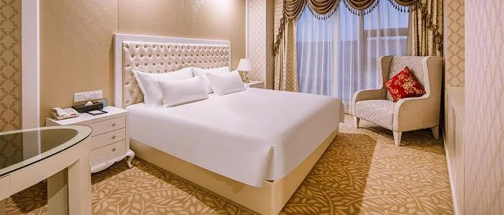 Bed in New Century Hotel Putuo Zhoushan
