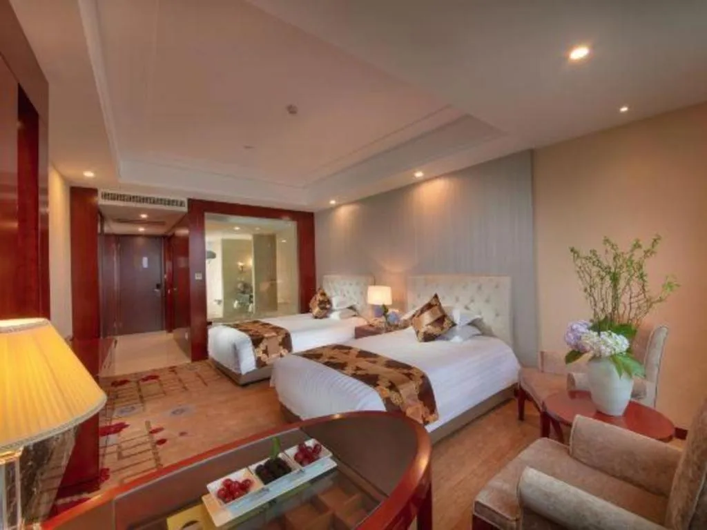 Bed in New Century Hotel Putuo Zhoushan