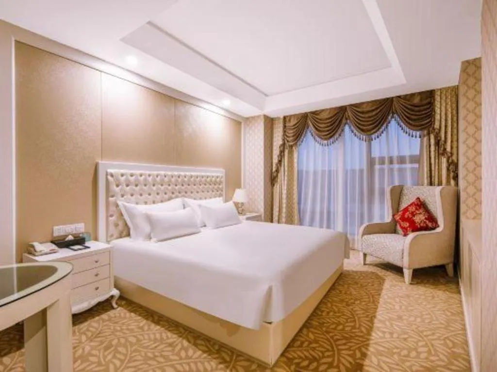 Bed in New Century Hotel Putuo Zhoushan
