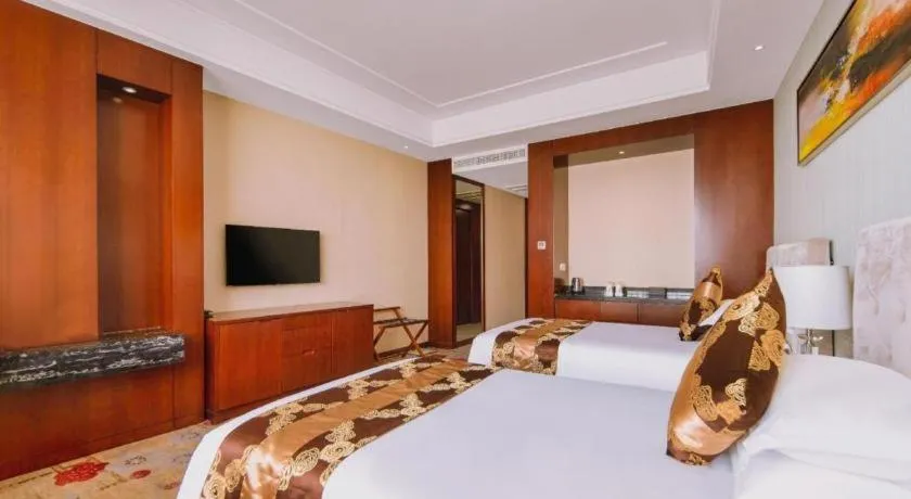 Bed in New Century Hotel Putuo Zhoushan