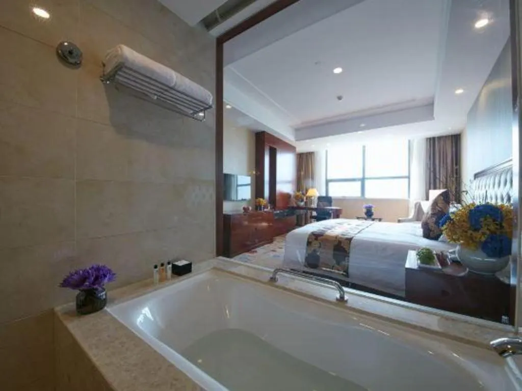 Bed in New Century Hotel Putuo Zhoushan