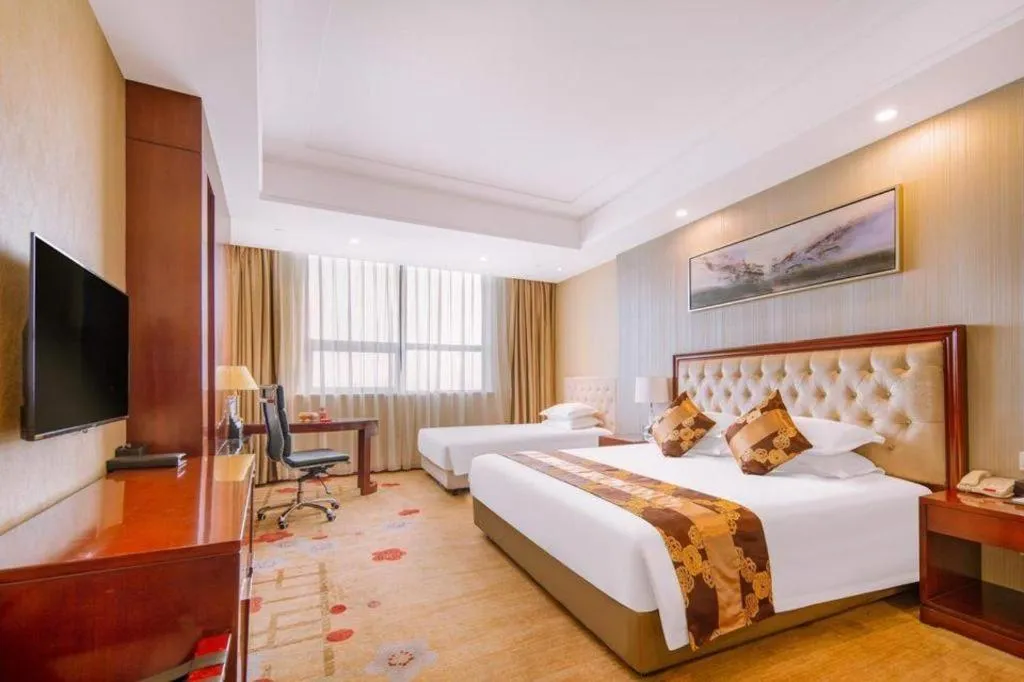 Bed in New Century Hotel Putuo Zhoushan
