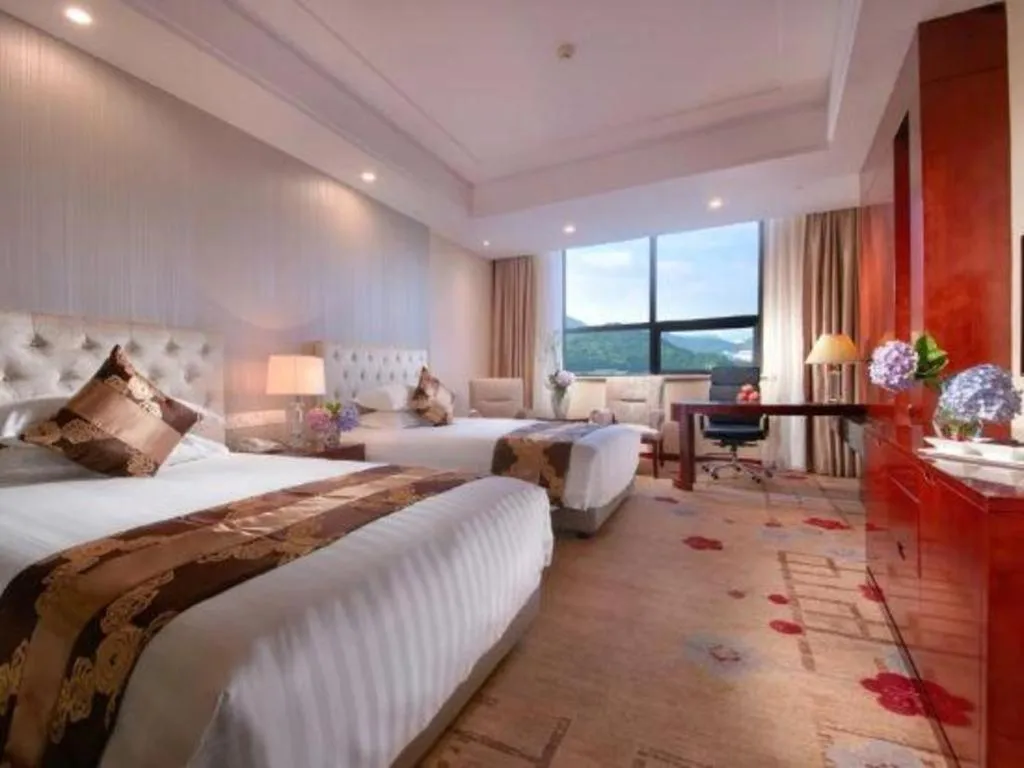 Bed in New Century Hotel Putuo Zhoushan