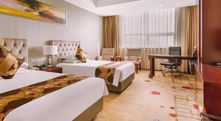 Bed in New Century Hotel Putuo Zhoushan