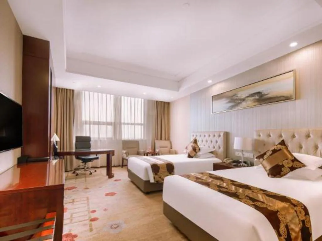 Bed in New Century Hotel Putuo Zhoushan